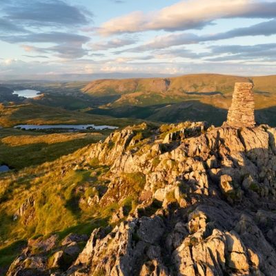 The mountain summit of Place Fell in the Lake District at sunset